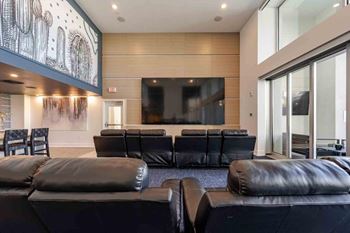 Theater-style seating with multi-screen entertainment